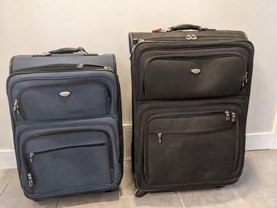 Dockers Expandable Rolling Suitcase - Carry-On and Checked size with Multiple Compartments