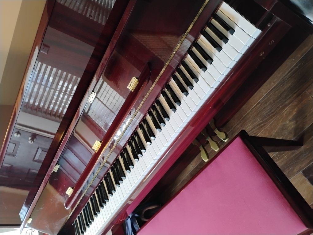 Red Samick upright piano
