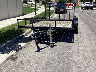 Flatbed utility trailer.