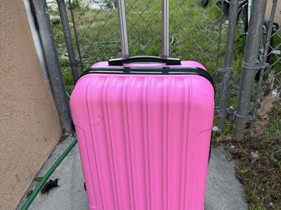 Pink hard sheel luggage 24” Tall