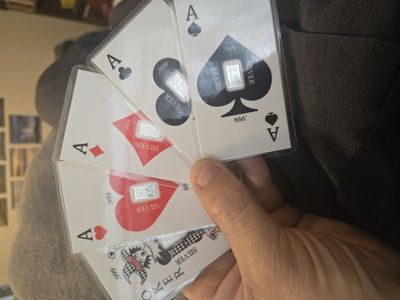 Playing cards with silver bars integrated