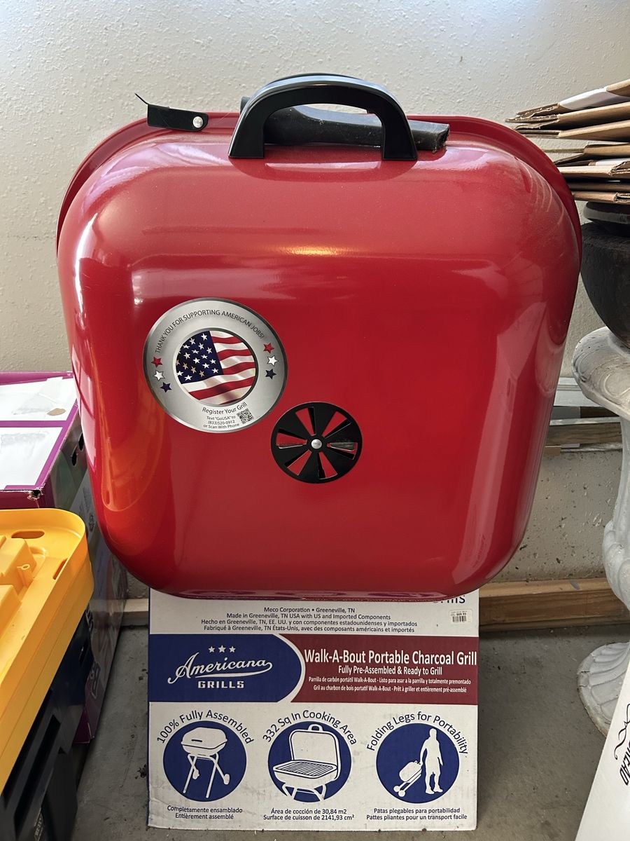New- never used Portable Grill + 2 bags Charcoal