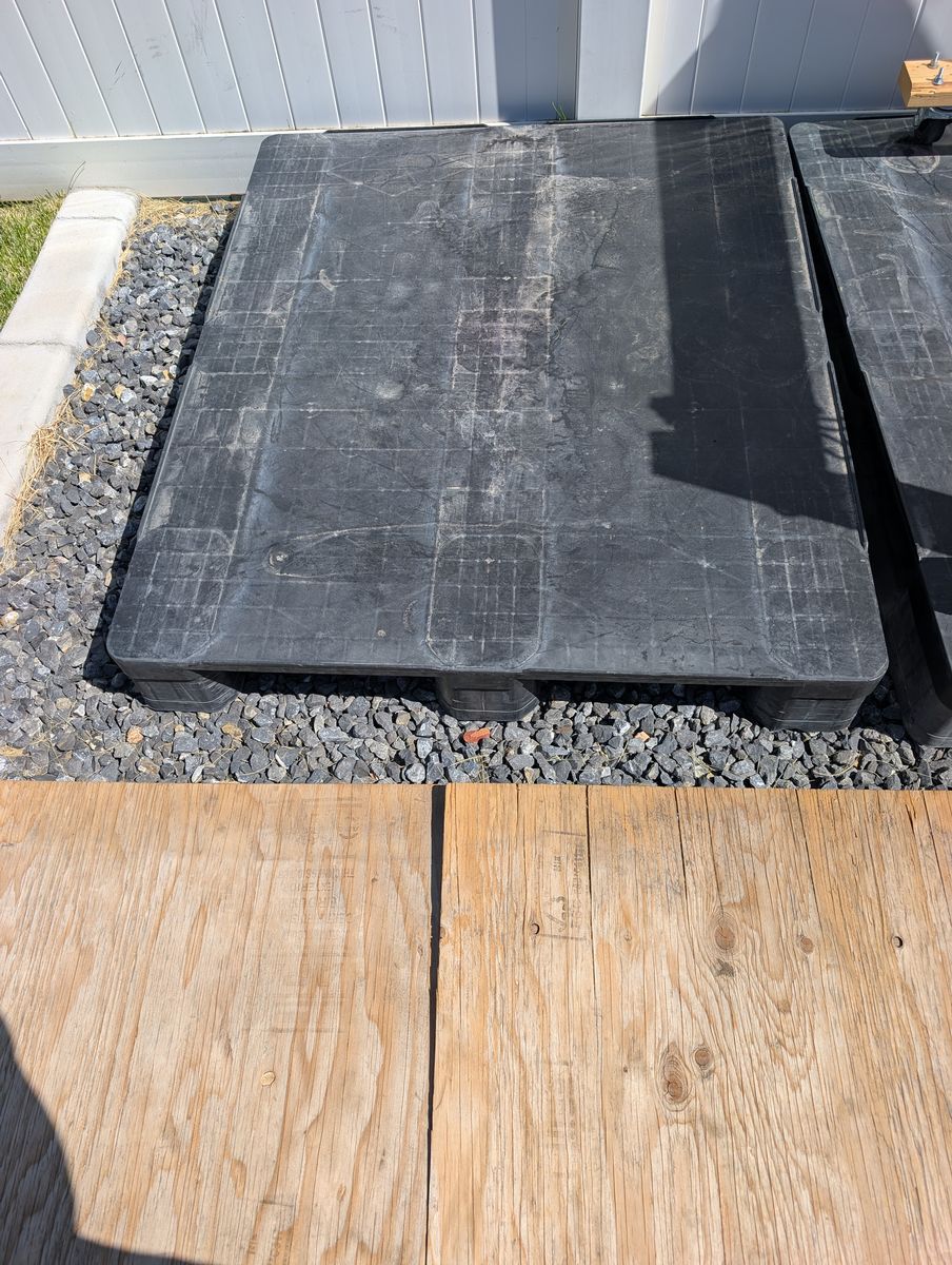 2 plastic pallets and 1 wooden pallet