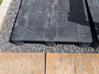 2 plastic pallets and 1 wooden pallet