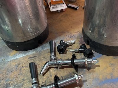 Homebrew kegs with taps.