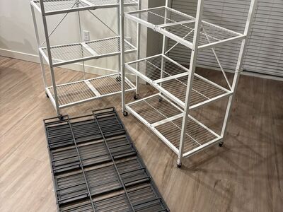 Two origami folding shelves and a folding iron bookshelf - $200