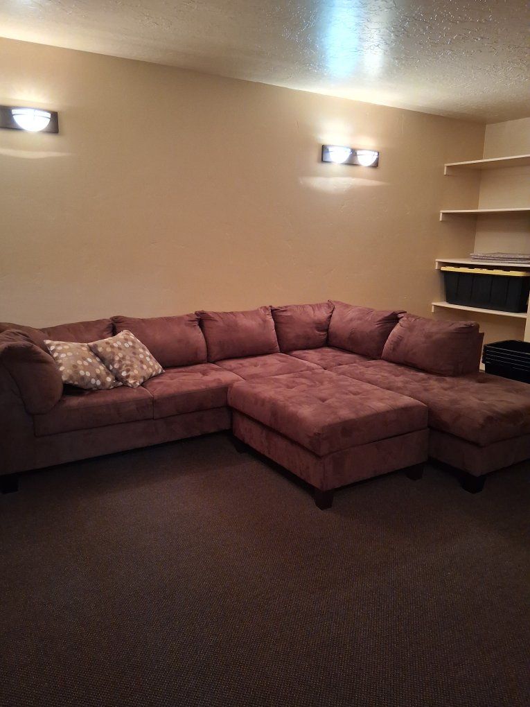Comfortable Brown Sectional Sofa with Ottoman - Spacious Seating