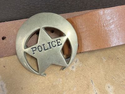 Brass belt buckle. Police