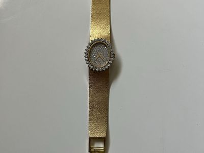 Vintage 18KT (stamped) Yellow Gold watch. Diamond encrusted. Pave face.