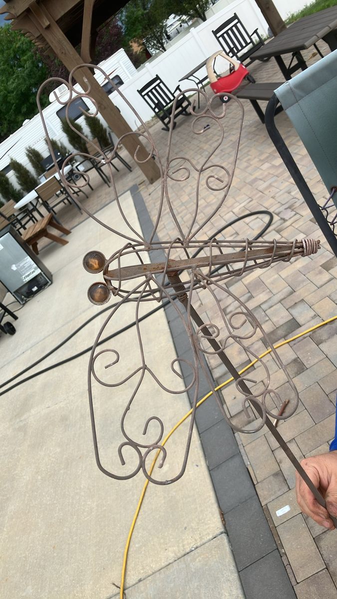 Yard decoration. Dragonfly on a stake