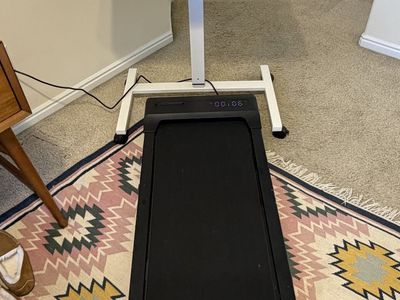 Standing desk with walking pad