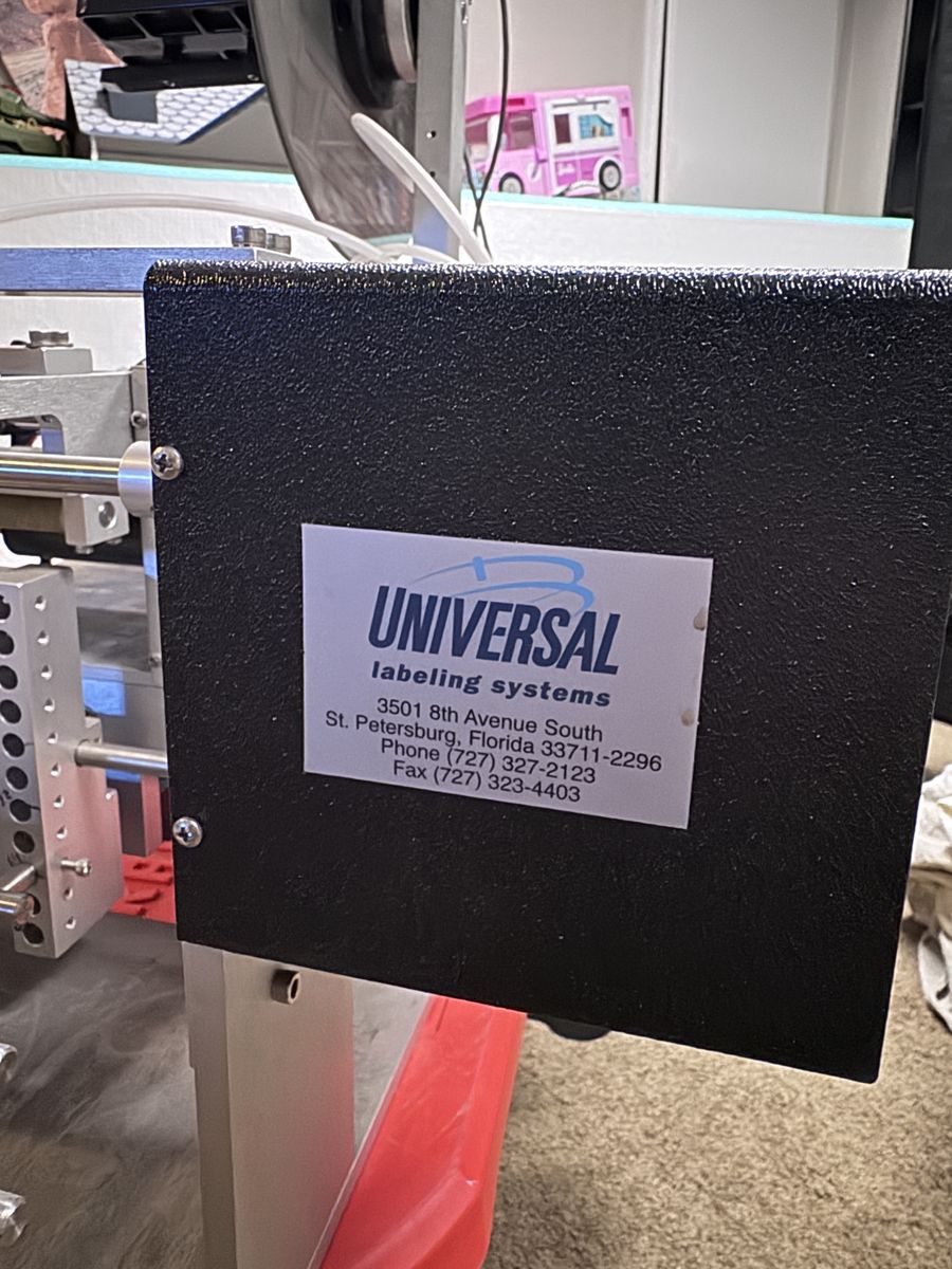 Universal Labeling Systems Labeler Machine - Industrial Labeling Equipment