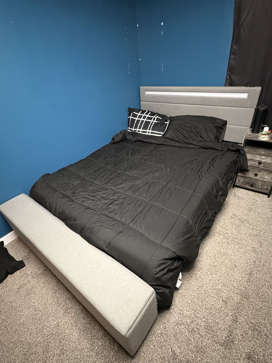 Adjustable bed frame with LED head board and a storage