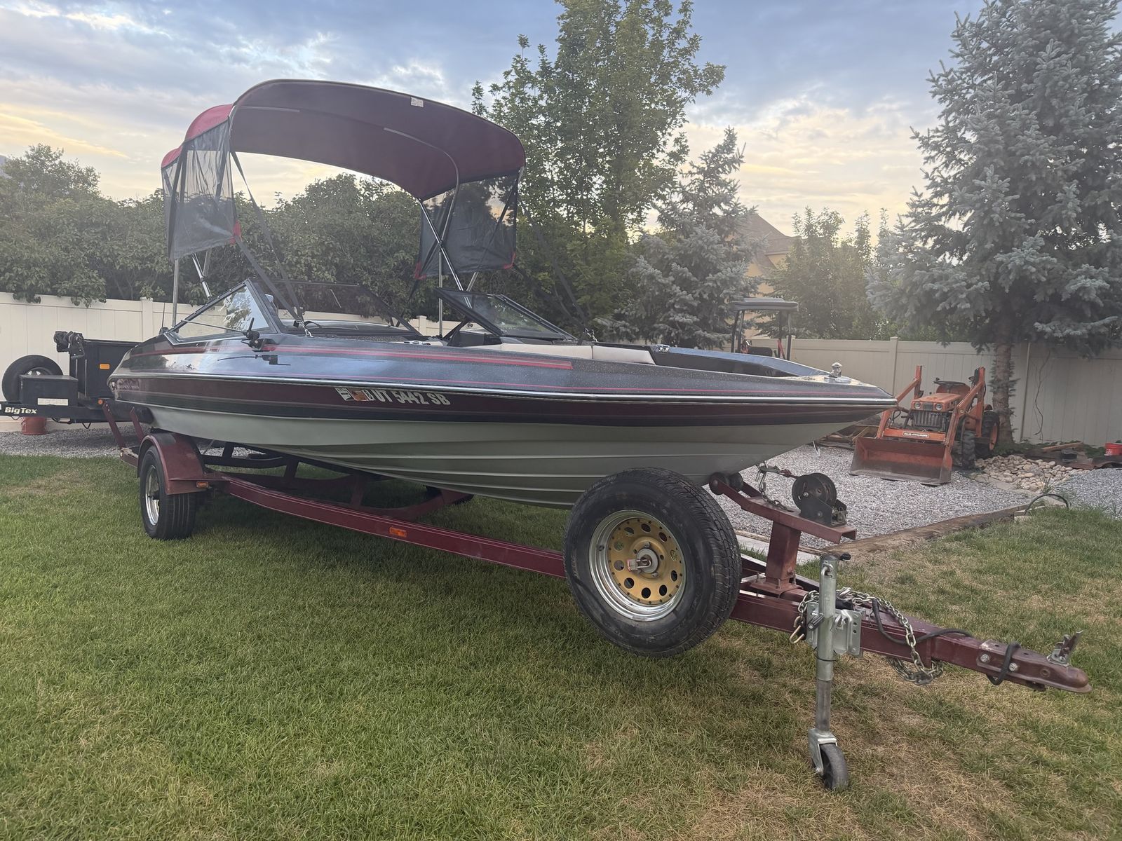 Powerboat with Bimini Top and Matching Single-Axle Trailer