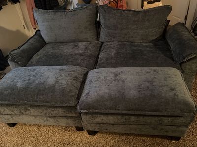 Basically new blue couch with two ottomans.