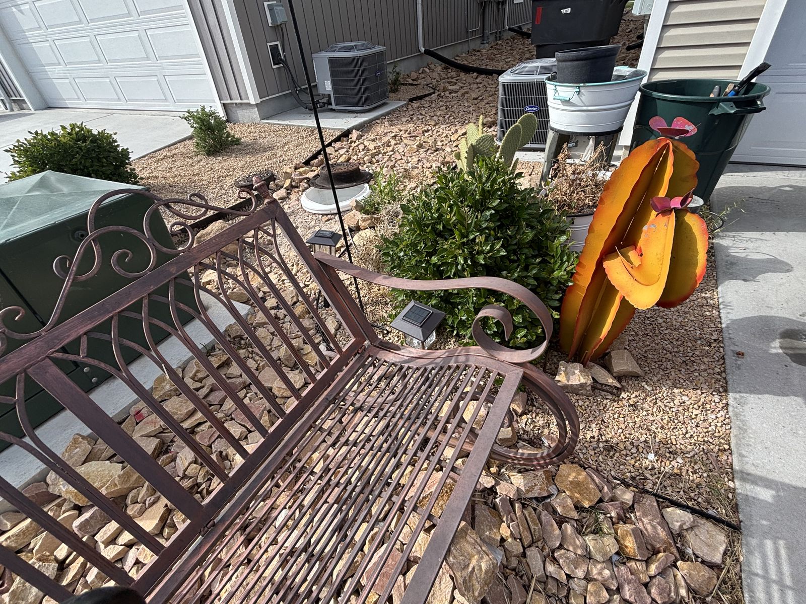 Rocking outdoor metal bench