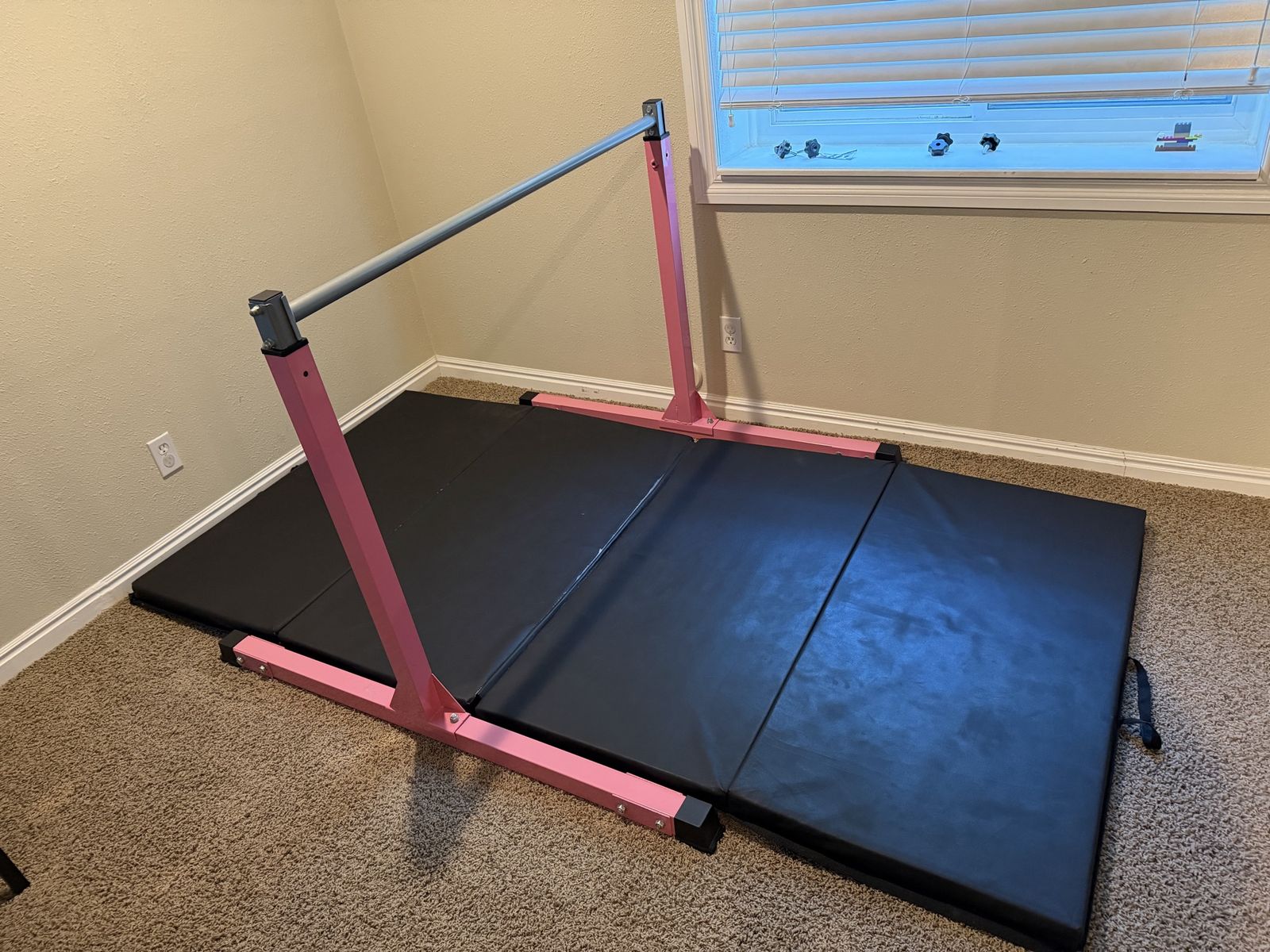 Kids gymnastics bar and mat.
