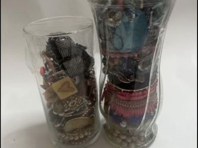 Two jars of costume/junk jewelry.