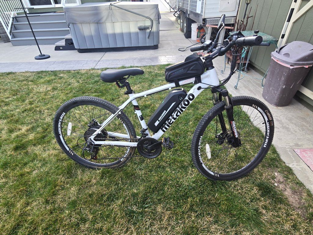 Two Metakoo E-bikes and Yahama bike rack