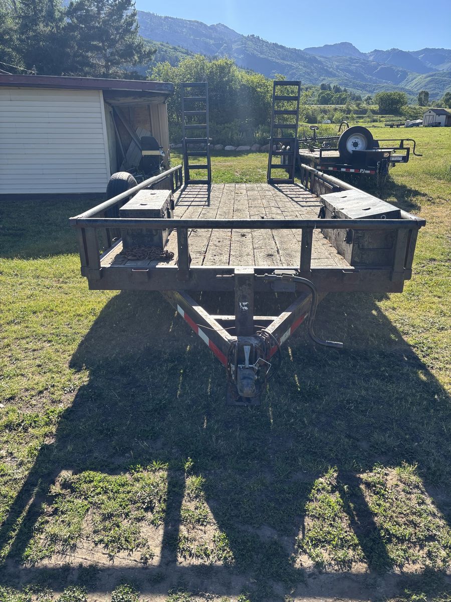 Dual Axle Flatbed Utility Trailer with Fold-Down Ramps 