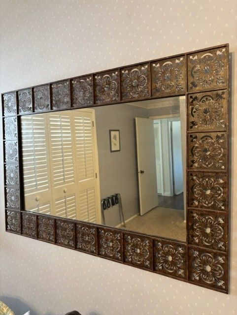 Handsome metal framed mirror