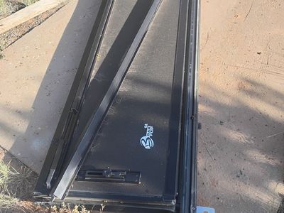 Bed cover for a short bed super duty Ford