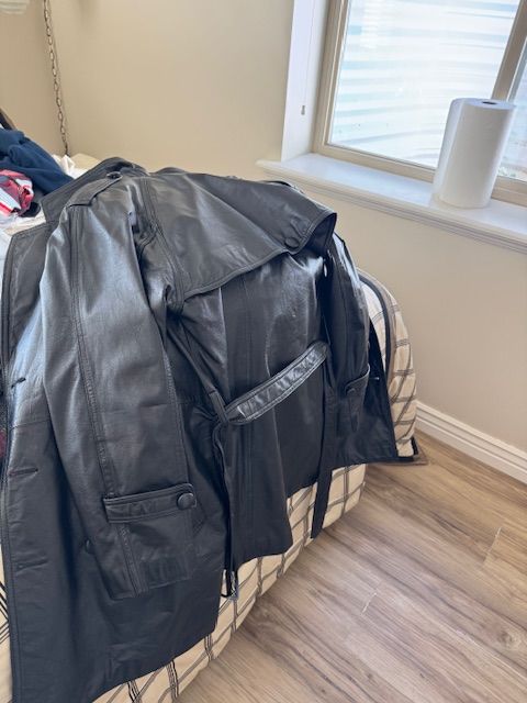 Women’s black leather long coat – belted – great condition