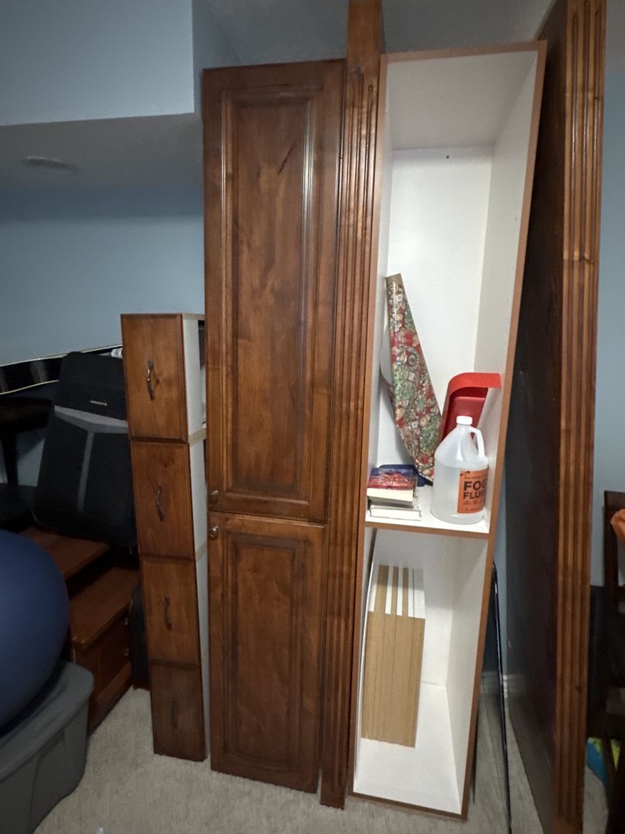 Random furniture pieces leftover from taking out a built in entertainment system