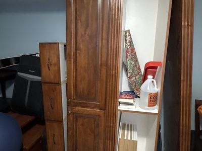 Random furniture pieces leftover from taking out a built in entertainment system