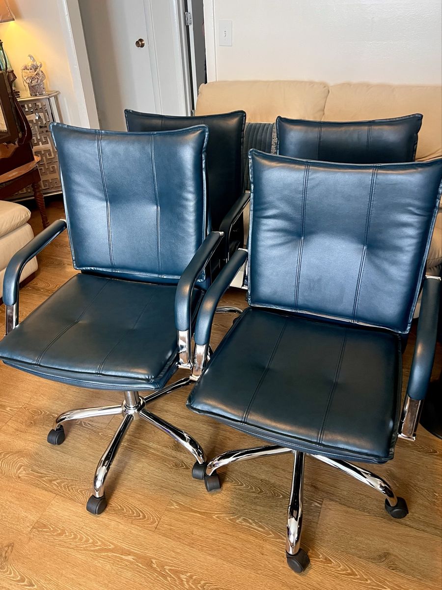 4 blue chairs on wheels
