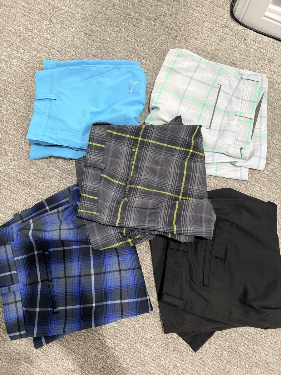 (4) Nike and (1) puma golf shorts size 34