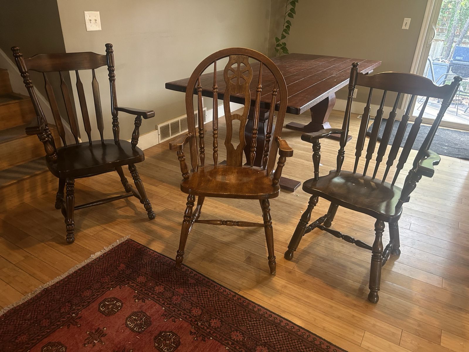 3 wooden chairs with armrests