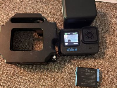 GoPro HERO 12 Action Camera with Batteries, Charger, and Protective Frame Case like new