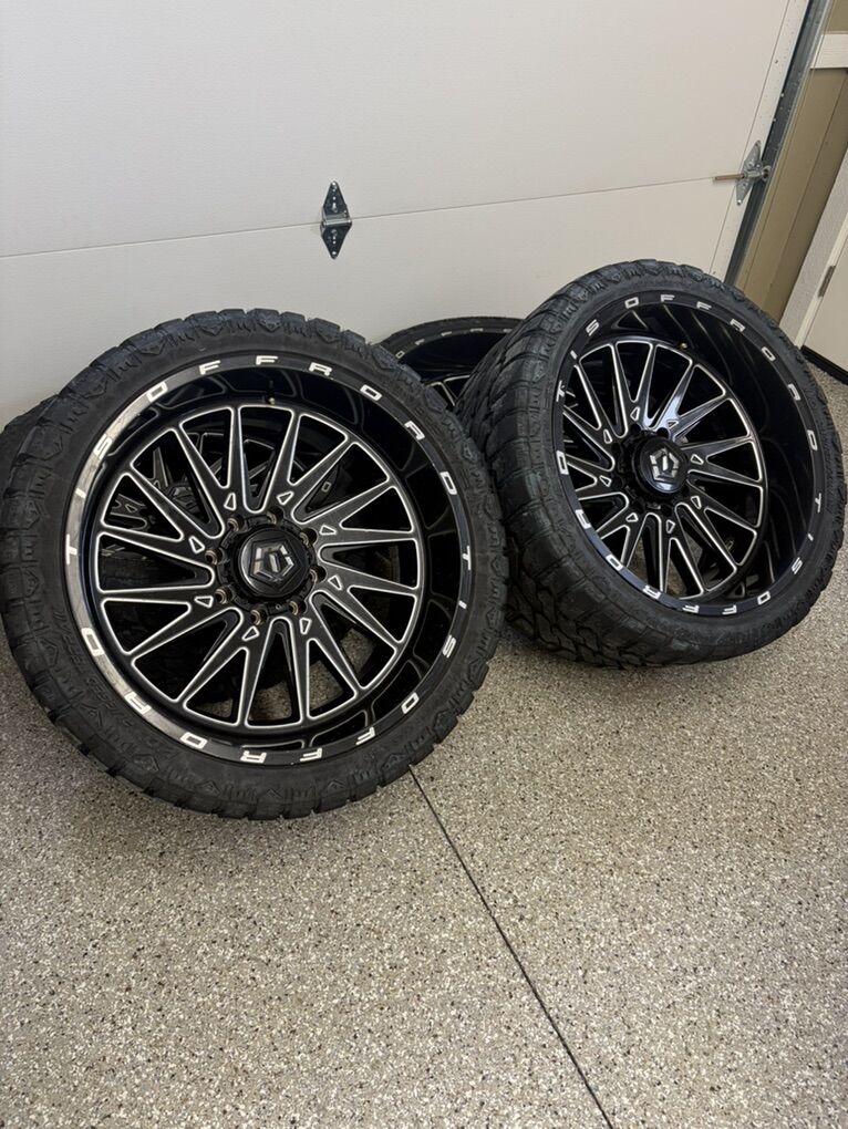 24x12 8x180 TIS Wheels On 33/14.50R 24 Tires