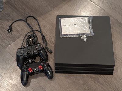 PlayStation 4 PS4 Pro 1tb w/ two controllers