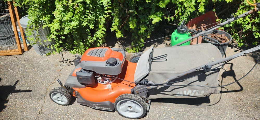 Husqvarna AWD Self-Propelled Gas Lawn Mower with Grass Bagger Attachment