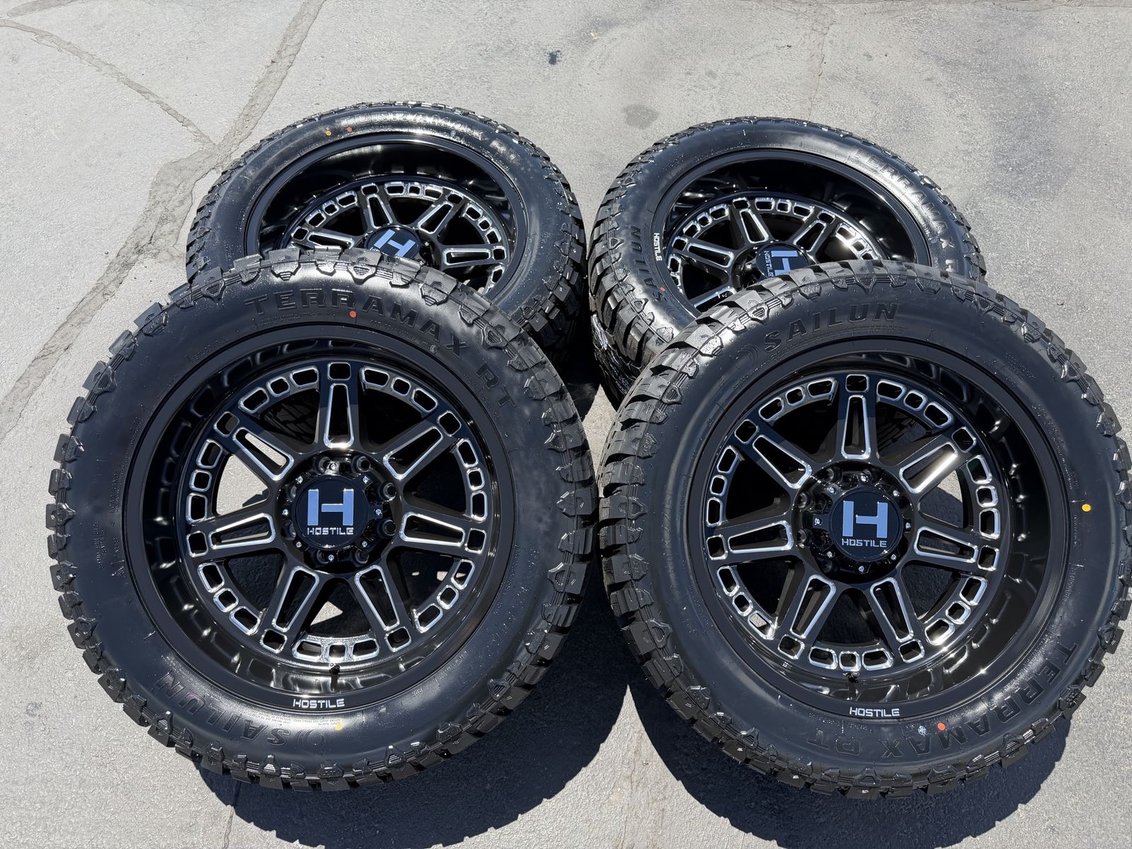 New Hostile H124 Lunatic 35x12.50r22 Terramax RT 8x170 Ford F250 F350 Superduty 8 lug Black Milled wheels and tires 3 peak rated