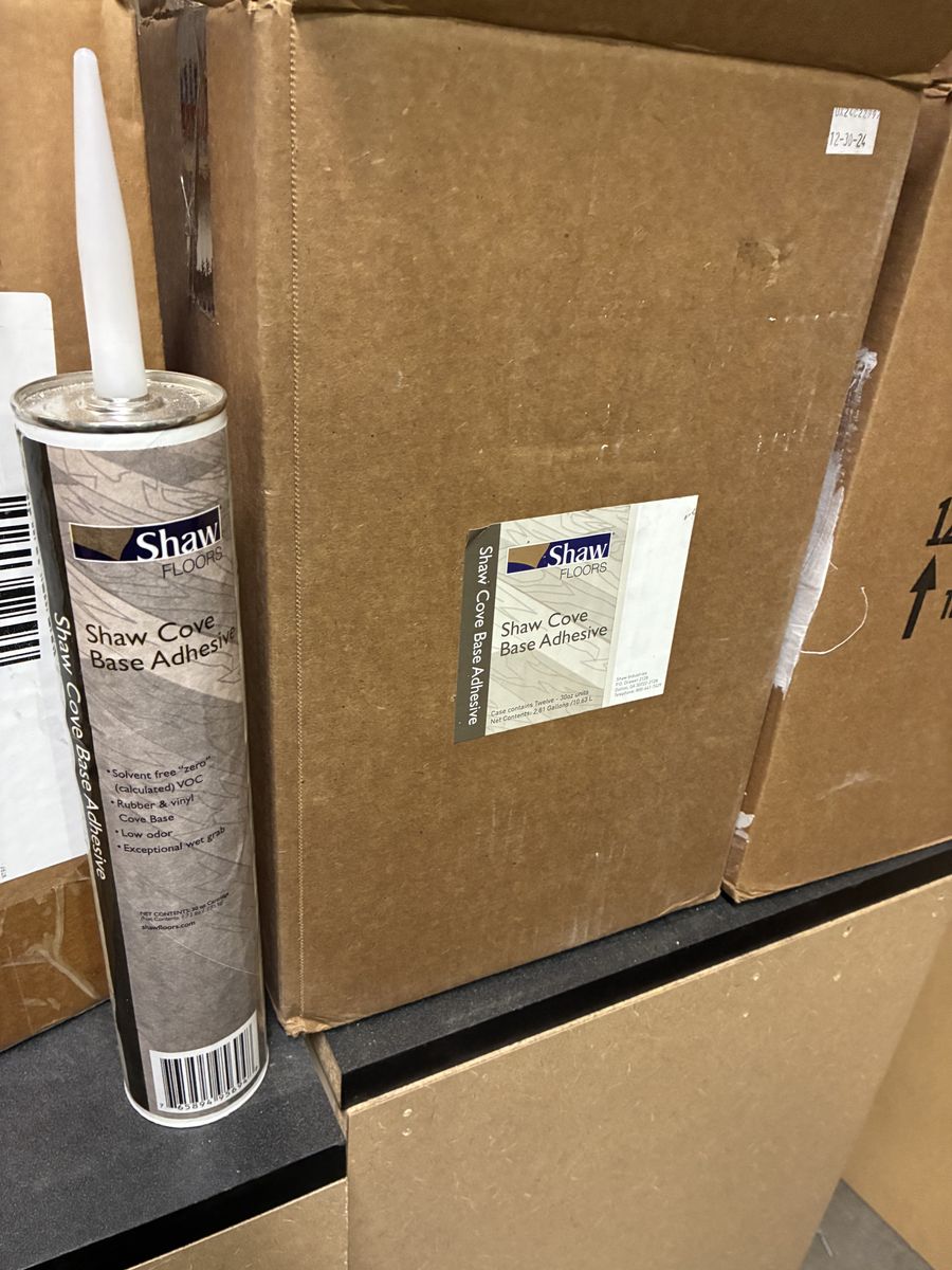 Cove base adhesive
