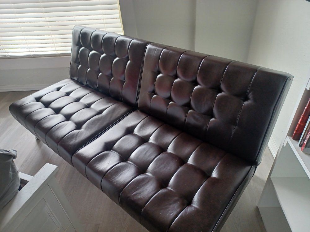 Very nice futon. Folds down into a bed with legs!