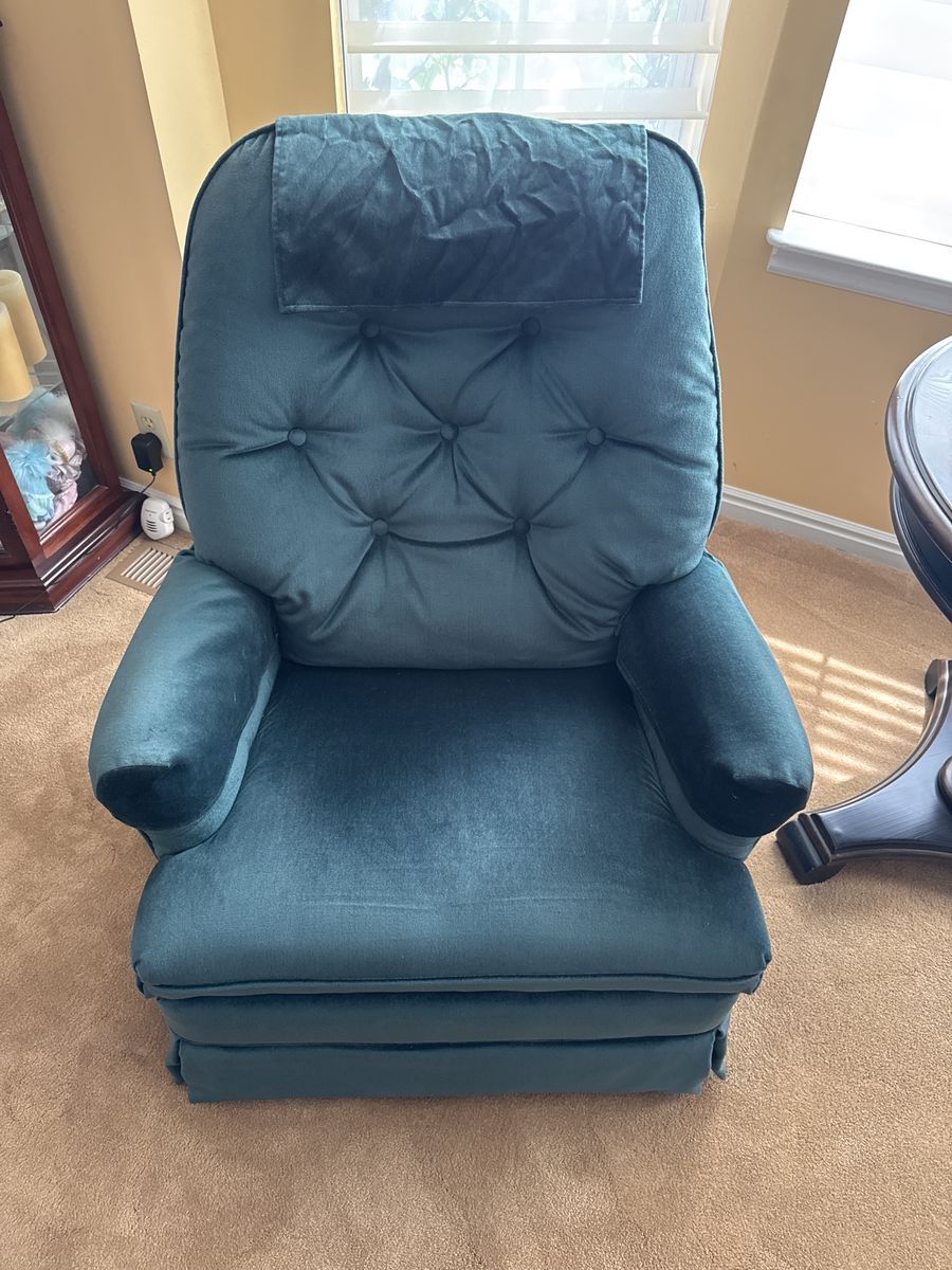 Two green recliner chairs