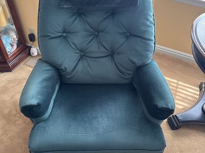 Two green recliner chairs
