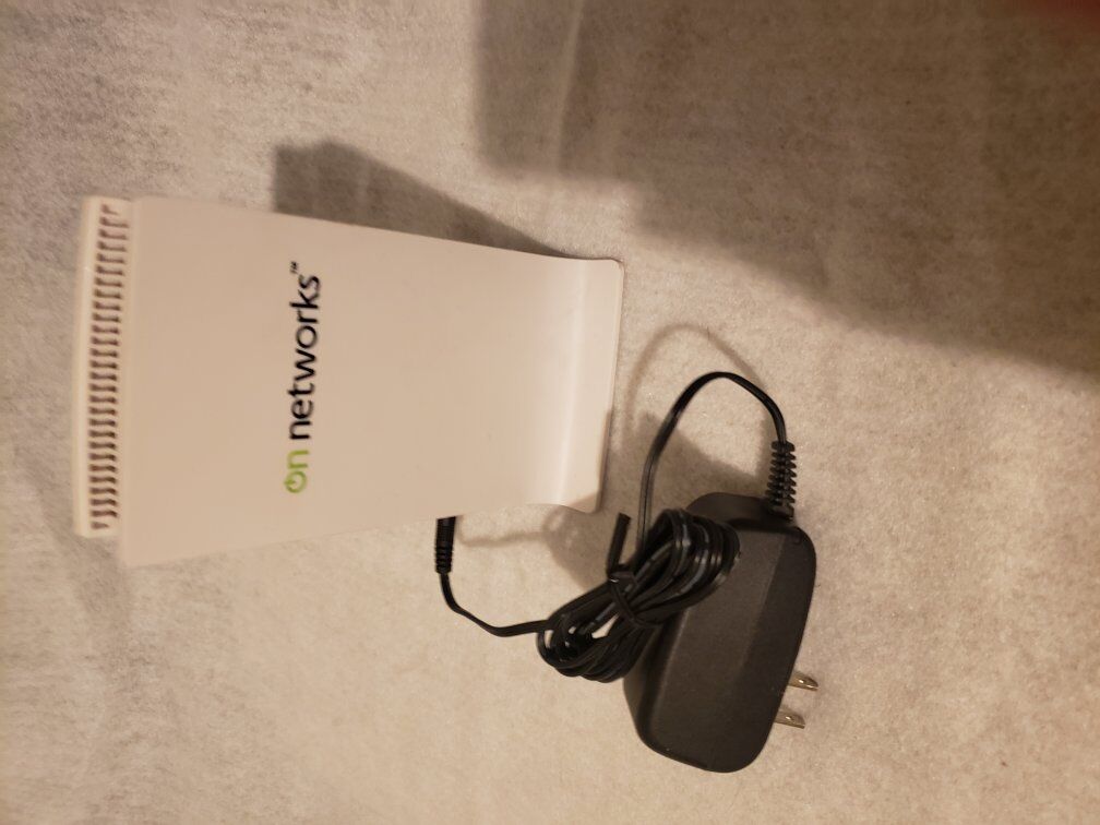 On Networks wifi router with power adapter.