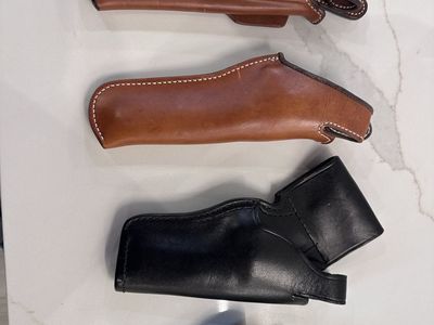 Leather pistol holsters