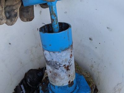 Glass crusher with bucket of mostly broken glass