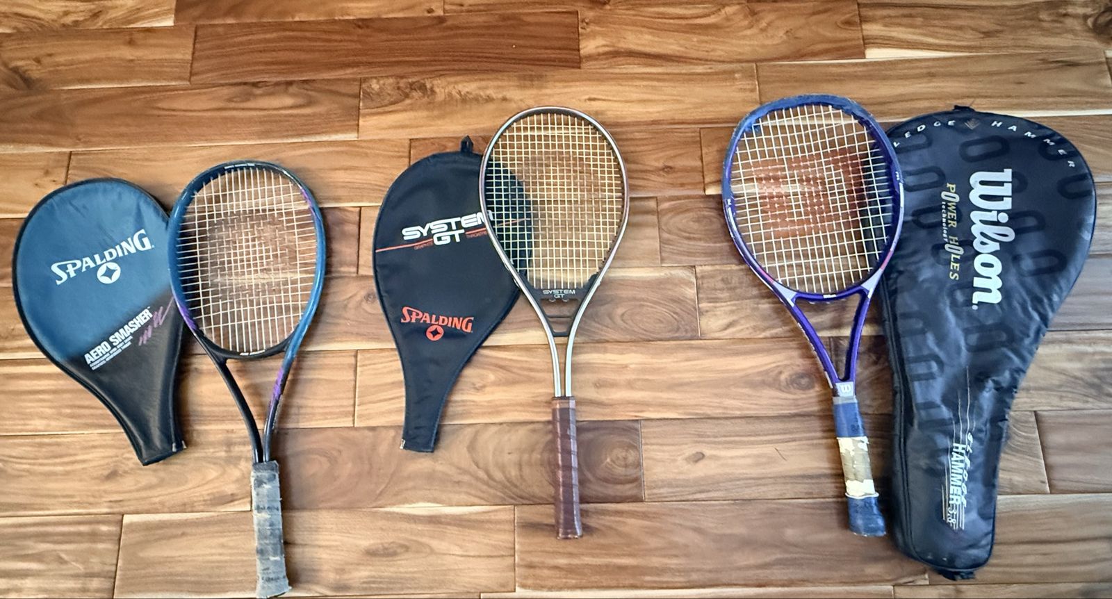 Three Tennis Rackets Two Spalding and one Wilson