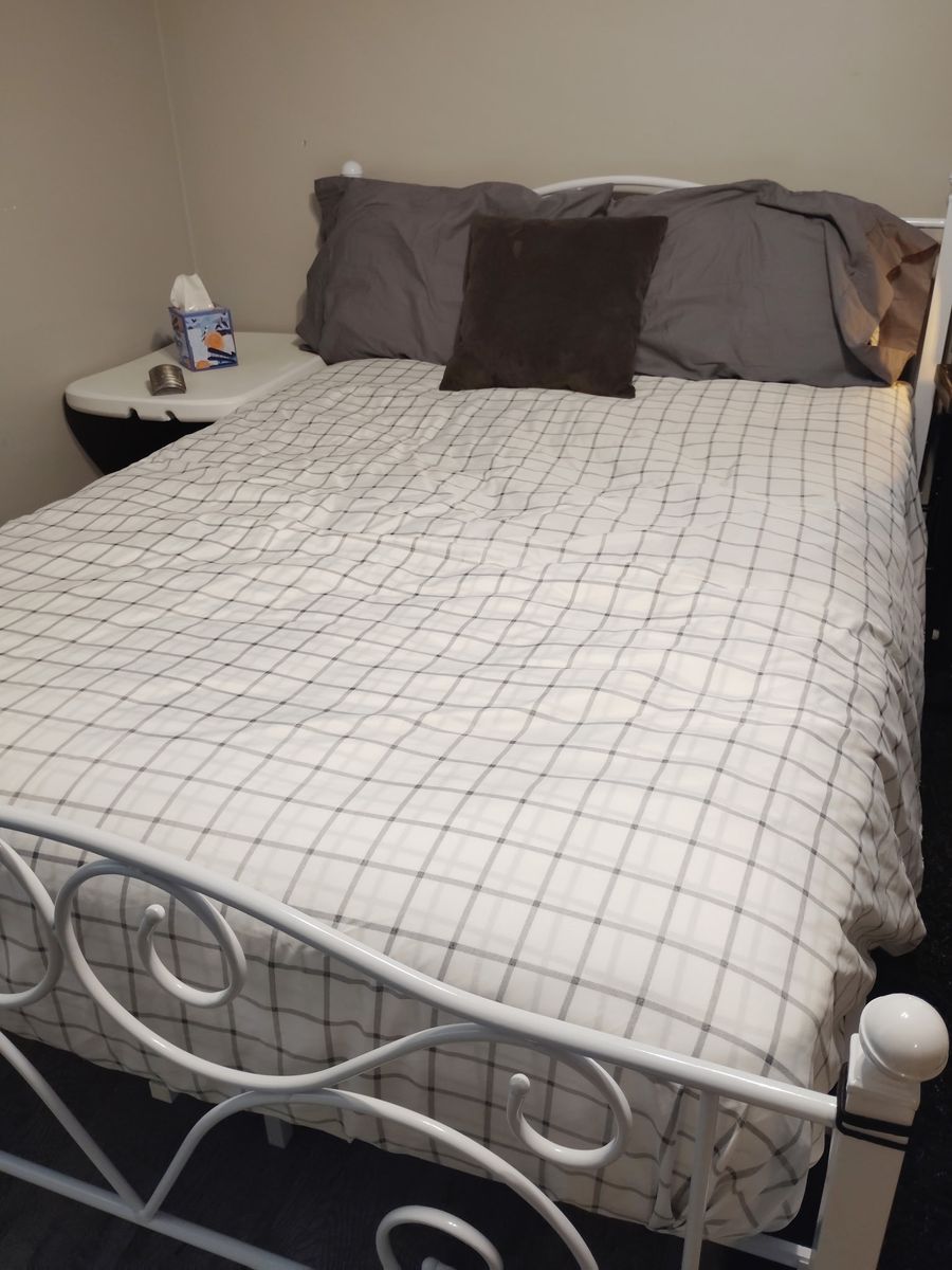 Full size Bed, Frame and New covered mattress