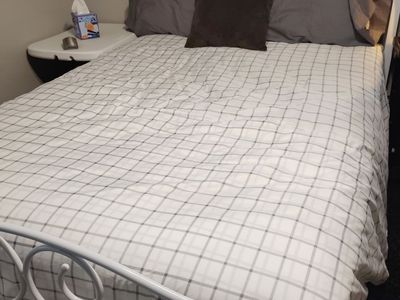 Full size Bed, Frame and New covered mattress