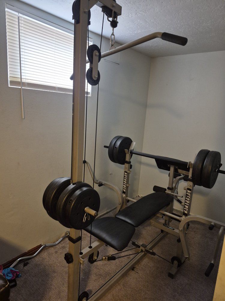 Weight Bench with Lat Pulldown Bar and Weights.