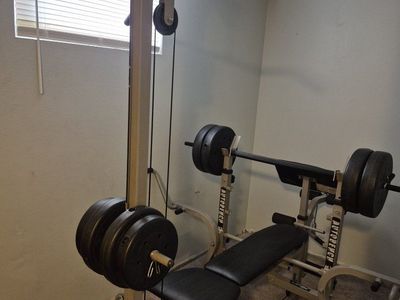 Weight Bench with Lat Pulldown Bar and Weights.