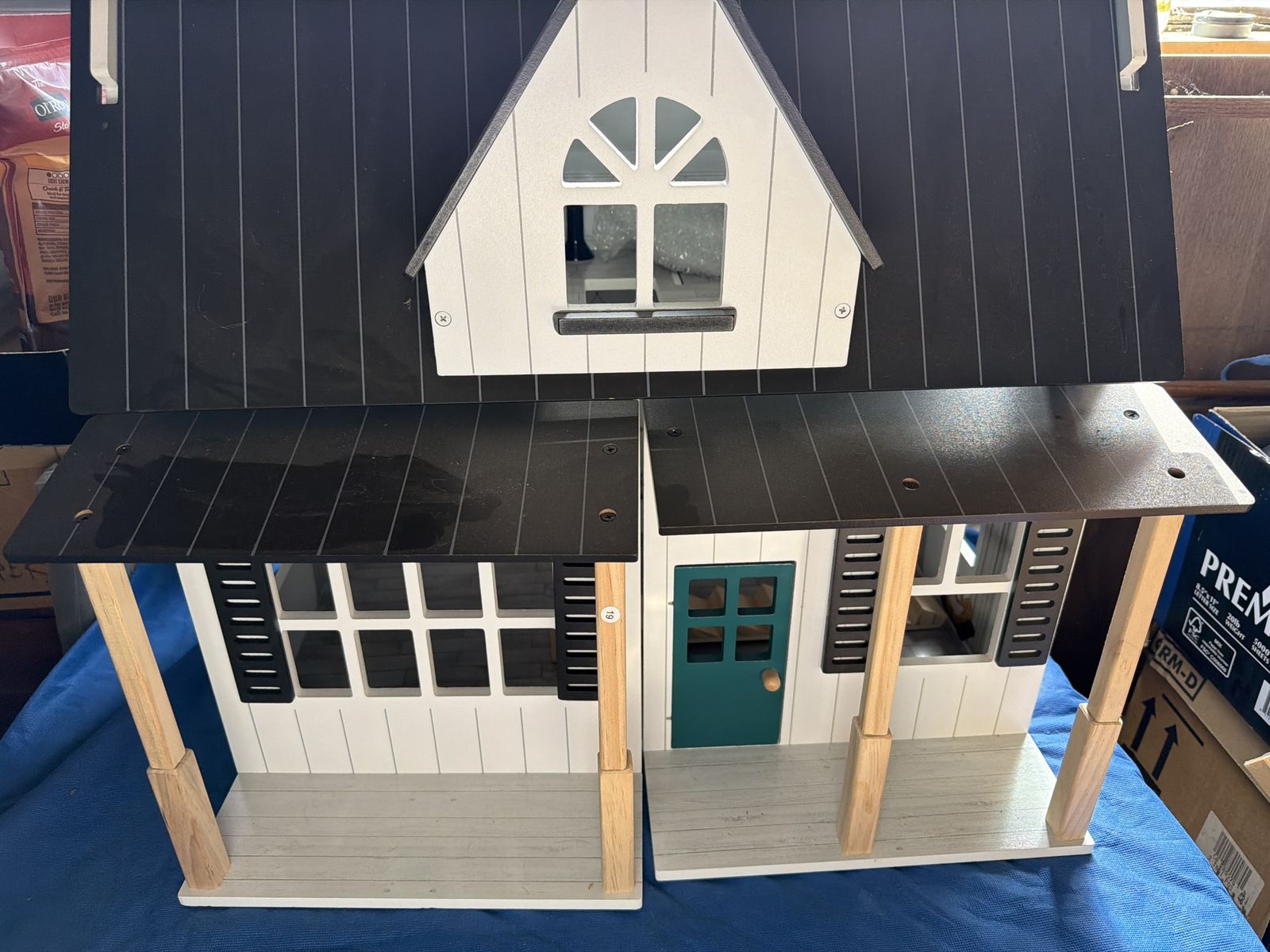 Members mark dollhouse